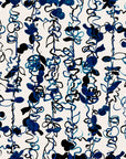 Abstract floral wallpaper with hand drawn botanical elements in deep blue and black tones on a white background, creating a dynamic and artistic design.