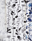 A collection of abstract floral patterned wallpapers in grayscale, black-and-white, and blue variations, featuring hand-drawn botanical elements on a white background.