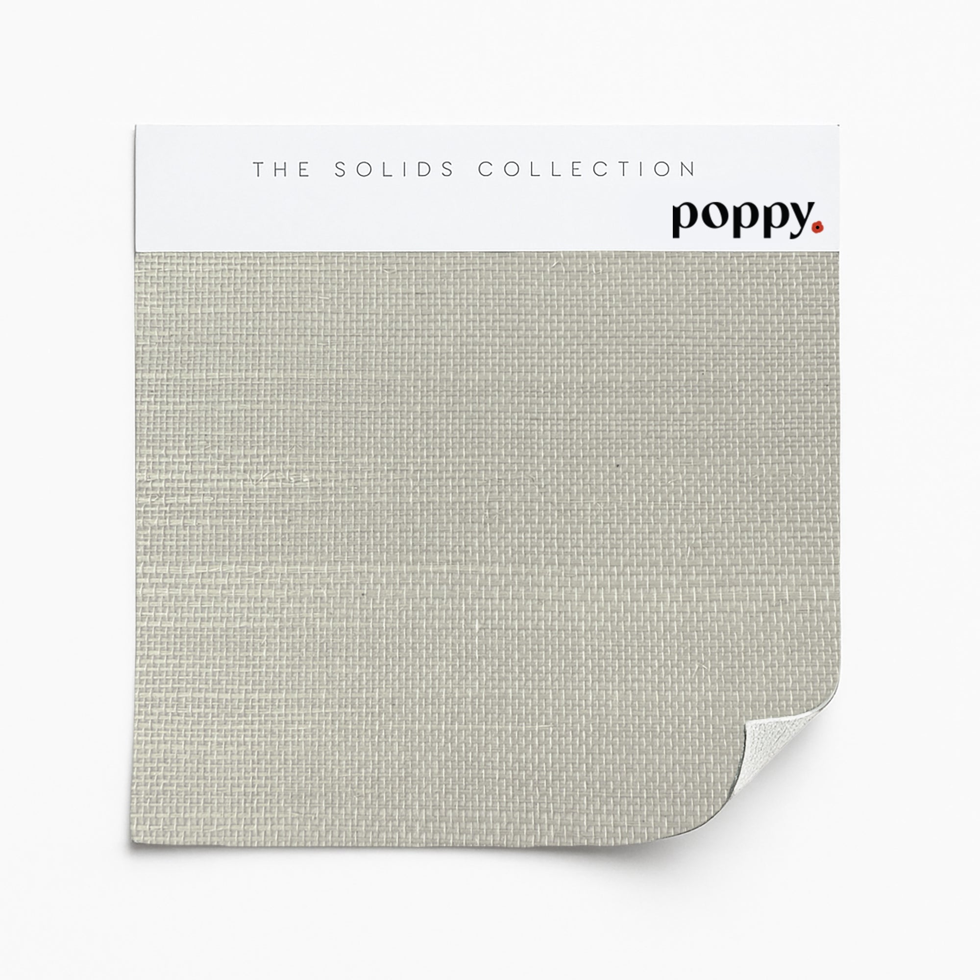Taupe-colored wallpaper sample on a tightly woven grasscloth from Poppy Print Studio’s Solids Collection