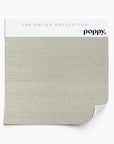 Taupe-colored wallpaper sample on a tightly woven grasscloth from Poppy Print Studio’s Solids Collection