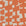 A close-up of geometric-patterned grasscloth wallpaper in bold orange and off-white, showcasing an abstract arrangement of irregularly shaped blocks.