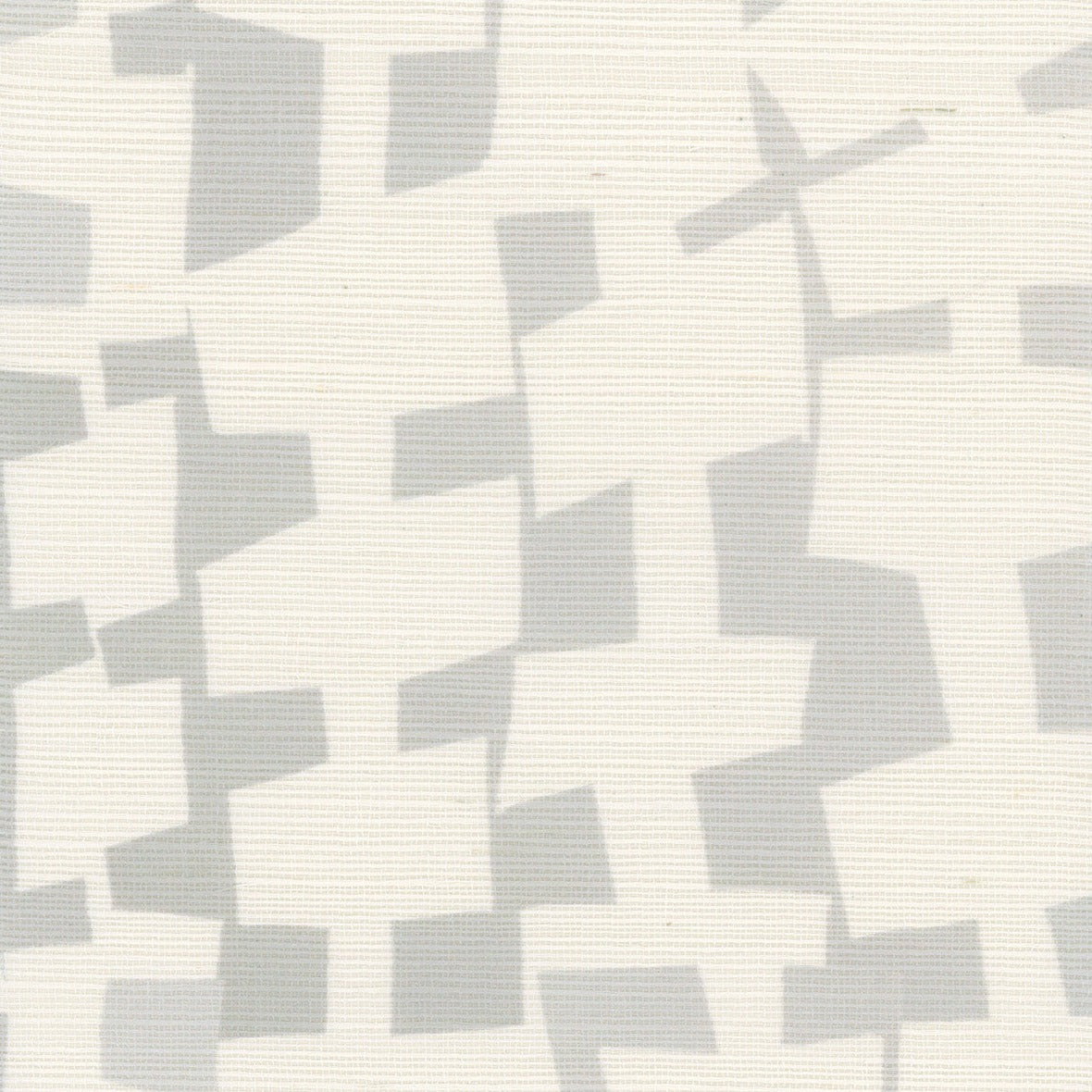 A close-up of geometric-patterned grasscloth wallpaper in soft gray and off-white, displaying an abstract arrangement of irregularly shaped blocks in a subtle, neutral palette.