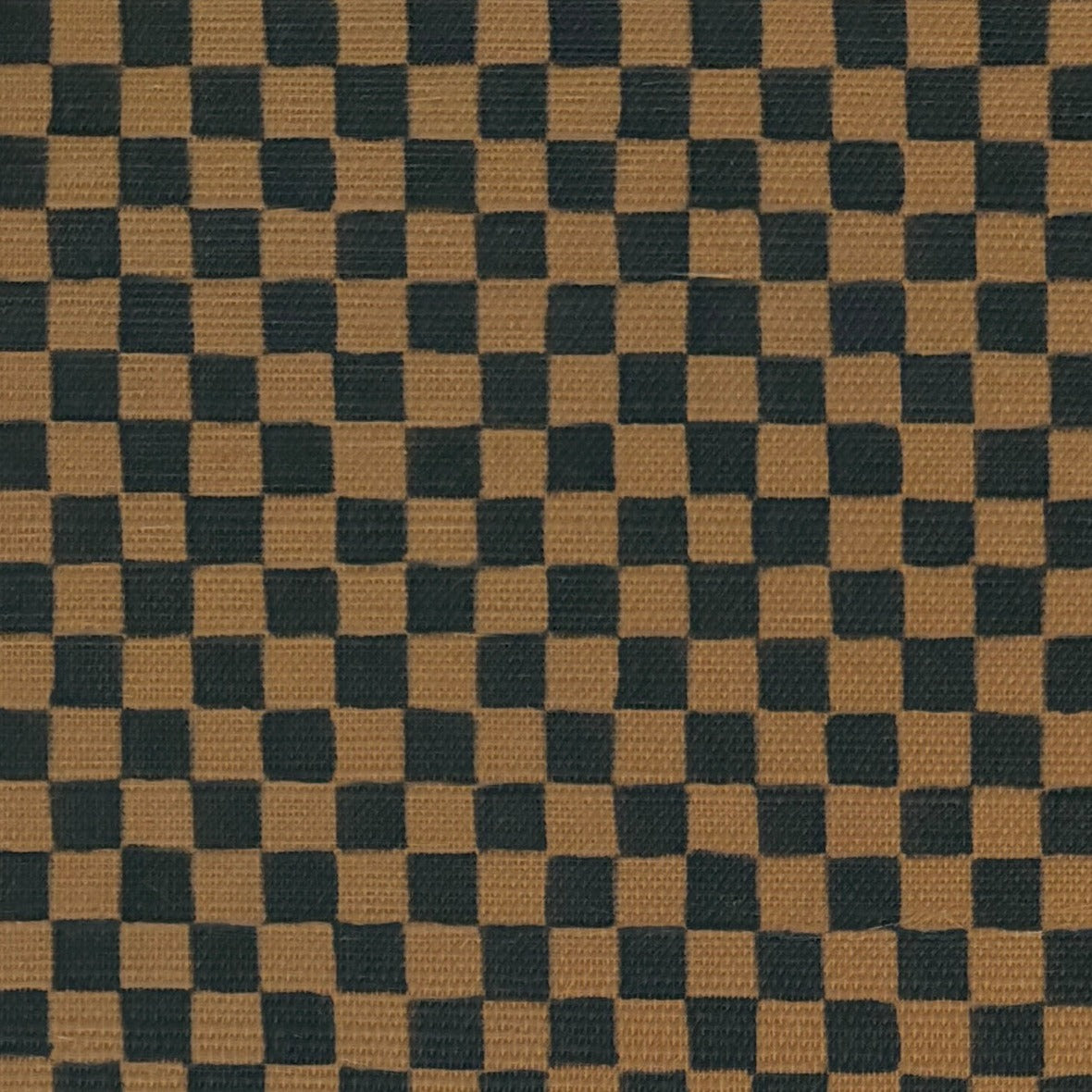 Close-up of deep brown and black checkered grasscloth wallpaper, showcasing its woven texture and subtle variations in color.
