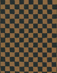 Close-up of deep brown and black checkered grasscloth wallpaper, showcasing its woven texture and subtle variations in color.
