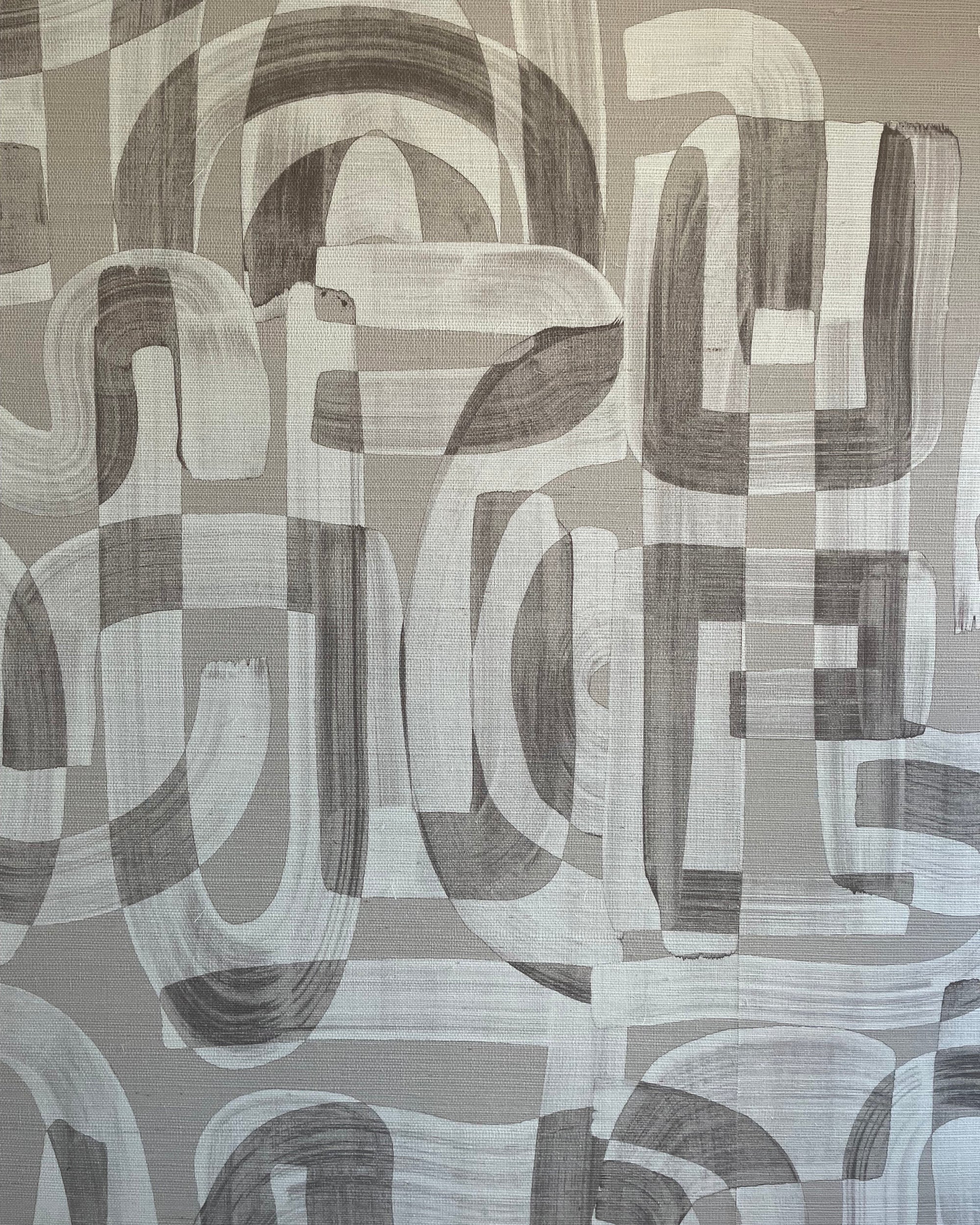 Close-up of taupe and white grasscloth wallpaper featuring an abstract brushstroke pattern with overlapping curved and geometric shapes.