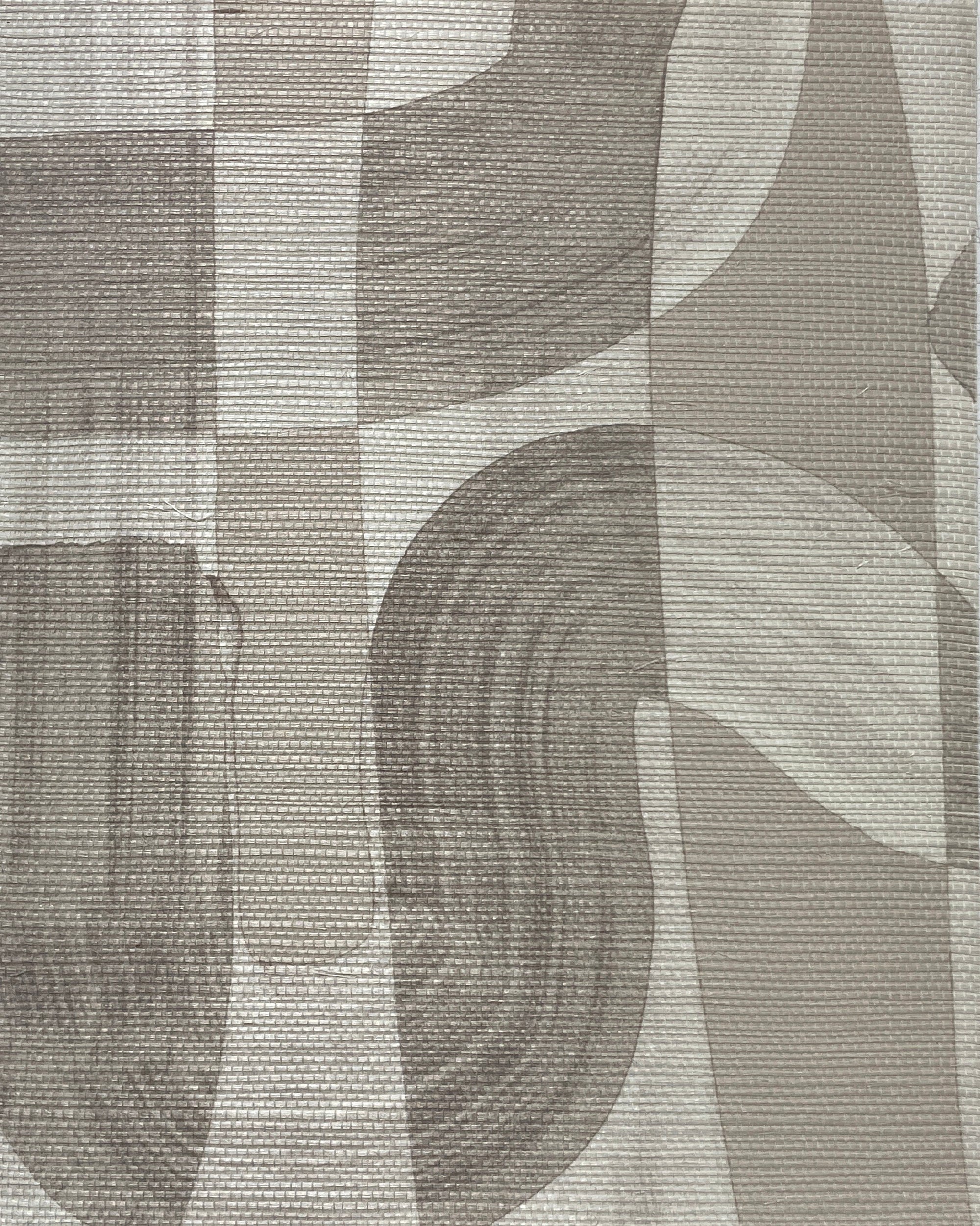 Close-up of tan grasscloth wallpaper, showcasing the soft brushstroke design and textured surface.