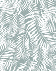 Soft green and white palm leaf wallpaper featuring a nature-inspired ripple effect, adding subtle movement to the design.
