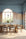 Blue and sandy beige gradient wallpaper with a painted sky effect, wrapping around a modern dining room with arched windows and wood furniture.