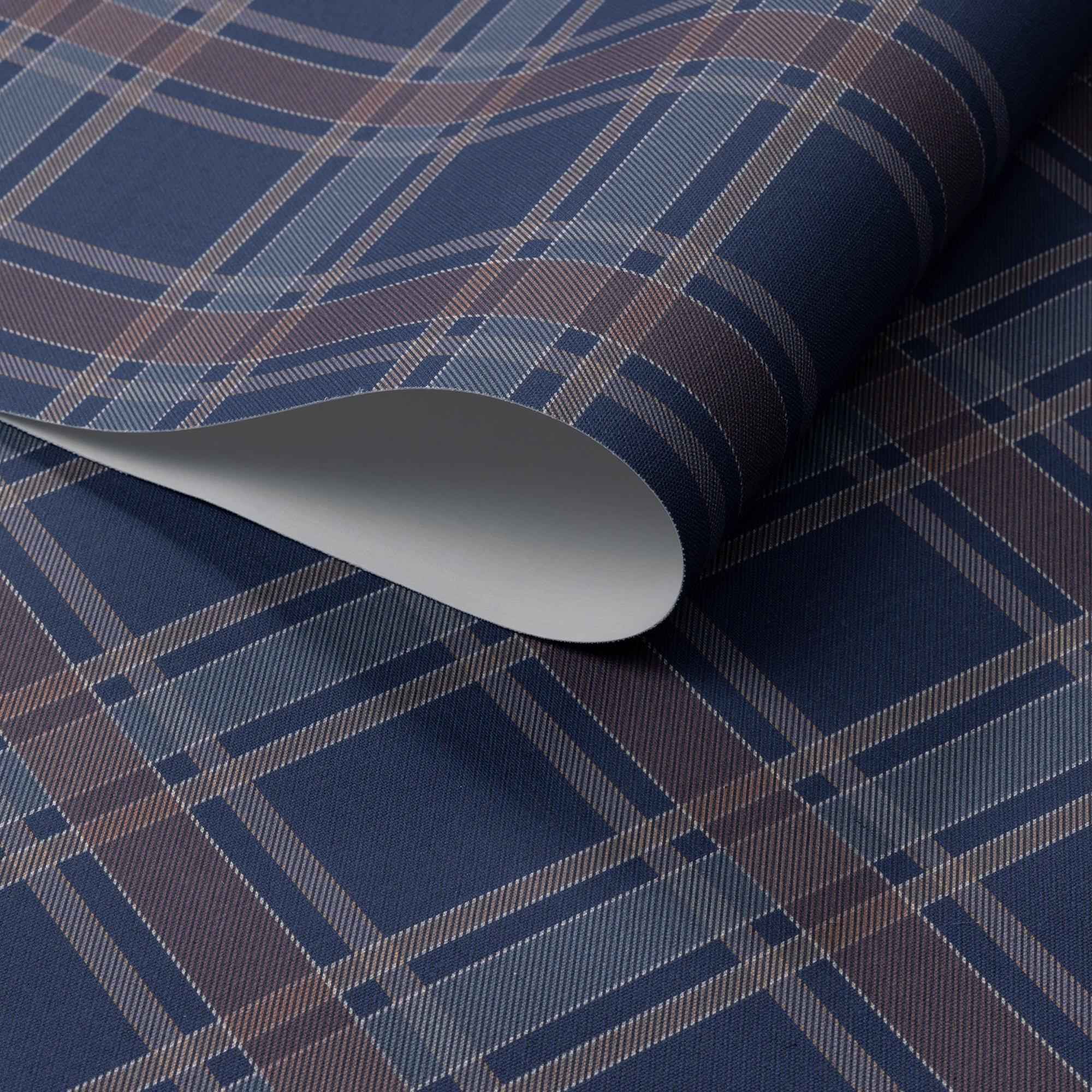 Rolled wallpaper featuring a rich navy blue base of linen wallpaper