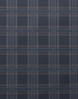 Flat lay of dark plaid linen wallpaper with a grid pattern of thin white, grey, and brown lines on a rich charcoal background.