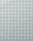 Full view of vintage plaid check wallpaper in muted blue and white, highlighting the evenly spaced check pattern and subtle linen texture.