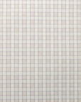 Flat view of linen wallpaper featuring a subtle vintage plaid check in muted beige and grey-blue.