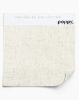 Neutral linen-textured wallpaper sample in off-white from Poppy Print Studio’s Solids Collection.