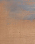 Grasscloth wallpaper with a painterly ombré effect blending warm terracotta and muted slate blue tones.