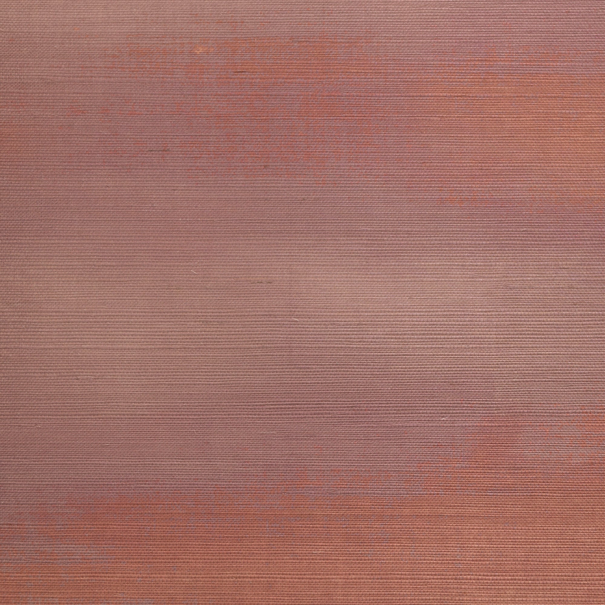 Warm-toned gradient grasscloth wallpaper in soft mauve and peach hues