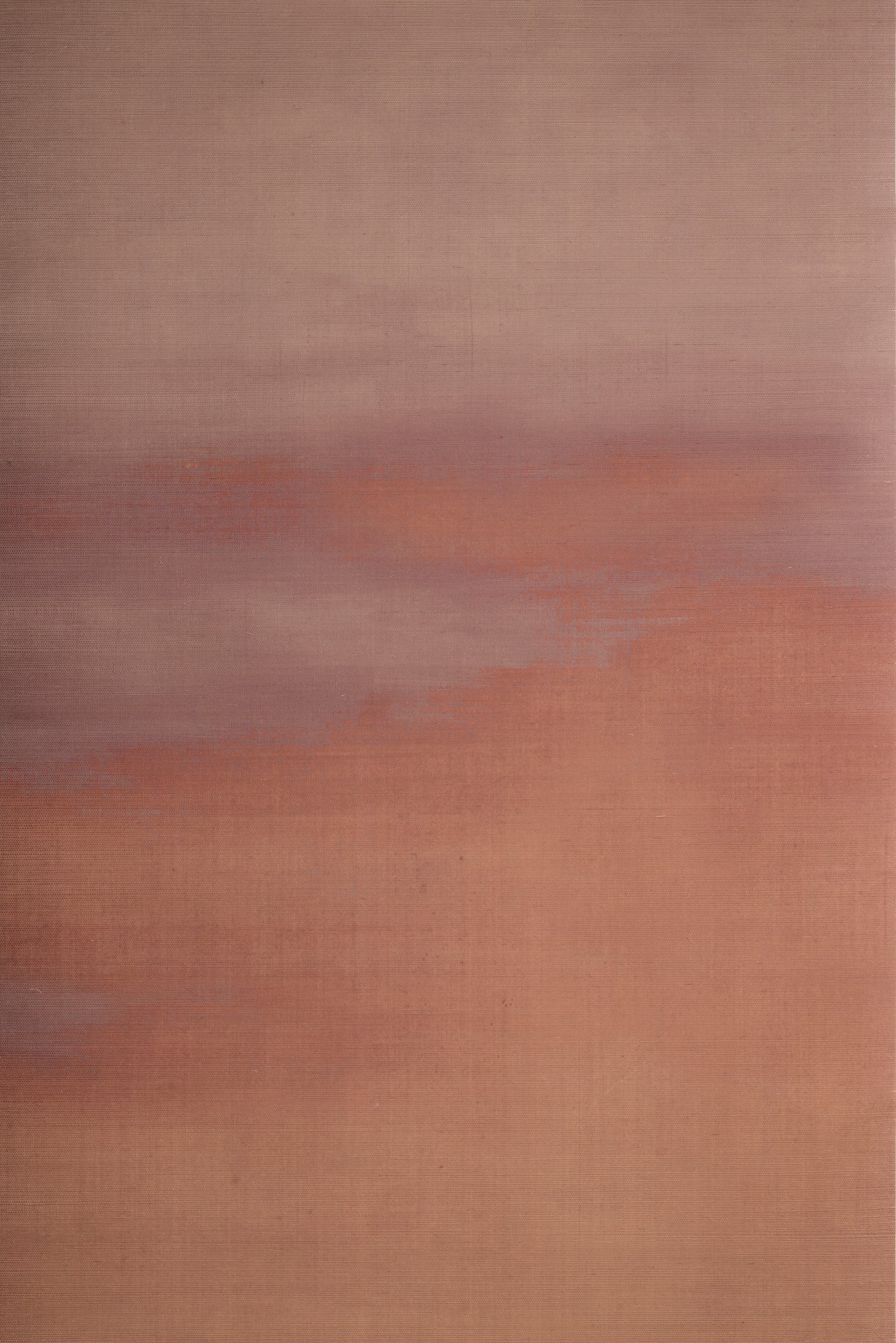 Warm-toned grasscloth wallpaper featuring a soft gradient of blush, terracotta, and muted mauve hues with a textured, painterly finish.