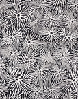 Black and white wallpaper with an abstract swirling pattern of wavy lines radiating
from circular centers, partially unrolled for texture display.
