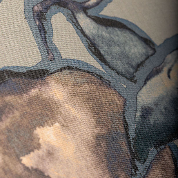 Close-up of a silk wallpaper featuring a watercolor-inspired botanical design in shades of blue, beige, and gray, with a hand-painted effect.