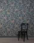 Room with silk wallpaper featuring a hand-painted botanical design in muted blue and beige tones, depicting delicate leaves and flowers, complemented by a black wooden chair in the corner.