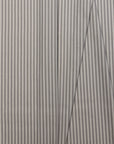 Tan and cream striped linen fabric by the yard, folded showing drape and weight