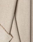 Beige herringbone outdoor fabric by the yard, folded showing drape and weight