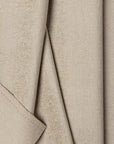 Cream chenille upholstery fabric by the yard, folded showing drape and weight