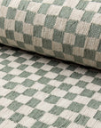 Olive green and cream checkerboard jacquard upholstery fabric by the yard, rolled bolt view