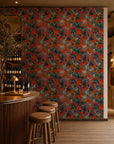 Teal floral on orange-red commercial wallcovering installed behind a wine bar