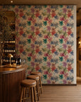 Multicolor floral on cream wallpaper installed behind a wine bar