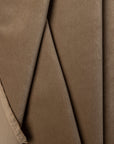 Tan velveteen upholstery fabric by the yard, folded showing drape and weight