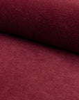 Burgundy velveteen upholstery fabric by the yard, rolled bolt view