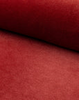 Red velveteen upholstery fabric by the yard, rolled bolt view
