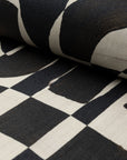 Black and cream abstract printed linen fabric by the yard, rolled bolt view
