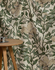 Cream and green floral printed linen fabric by the yard, draped to show pattern and scale