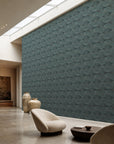 Aqua stippled petal geometric wallpaper installed in a skylit lounge