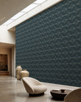 Deep teal stippled petal geometric wallpaper installed in a skylit lounge