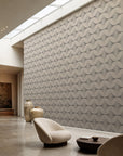 Off-white and black stippled petal geometric commercial wallcovering installed in a skylit lounge