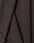 Black boucle upholstery fabric by the yard, folded showing drape and weight