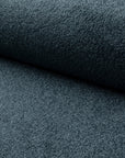 Blue boucle upholstery fabric by the yard, rolled bolt view