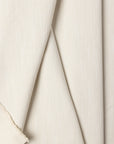Cream basketweave upholstery fabric by the yard, folded showing drape and weight
