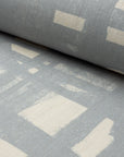 Blue and cream brushstroke crosshatch linen fabric by the yard, rolled bolt view
