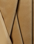 Gold velvet upholstery fabric by the yard, folded showing drape and weight