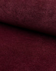 Red velvet upholstery fabric by the yard, rolled bolt view