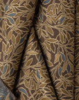 Brown botanical leaf jacquard upholstery fabric by the yard, folded showing drape and weight
