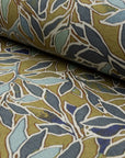 Olive gold and blue botanical leaf printed linen fabric by the yard, rolled bolt view