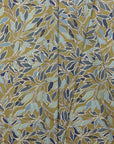 Olive gold and blue botanical leaf printed linen fabric by the yard, folded showing drape and weight