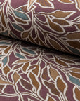 Deep maroon with teal botanical leaf jacquard upholstery fabric by the yard, rolled bolt view