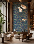 Blue and violet fruit and floral botanical wallpaper installed in a double-height lounge