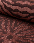 Rust sunburst jacquard upholstery fabric by the yard, rolled bolt view