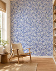 Cobalt blue and white abstract squiggle commercial wallcovering installed in a sunlit reading nook